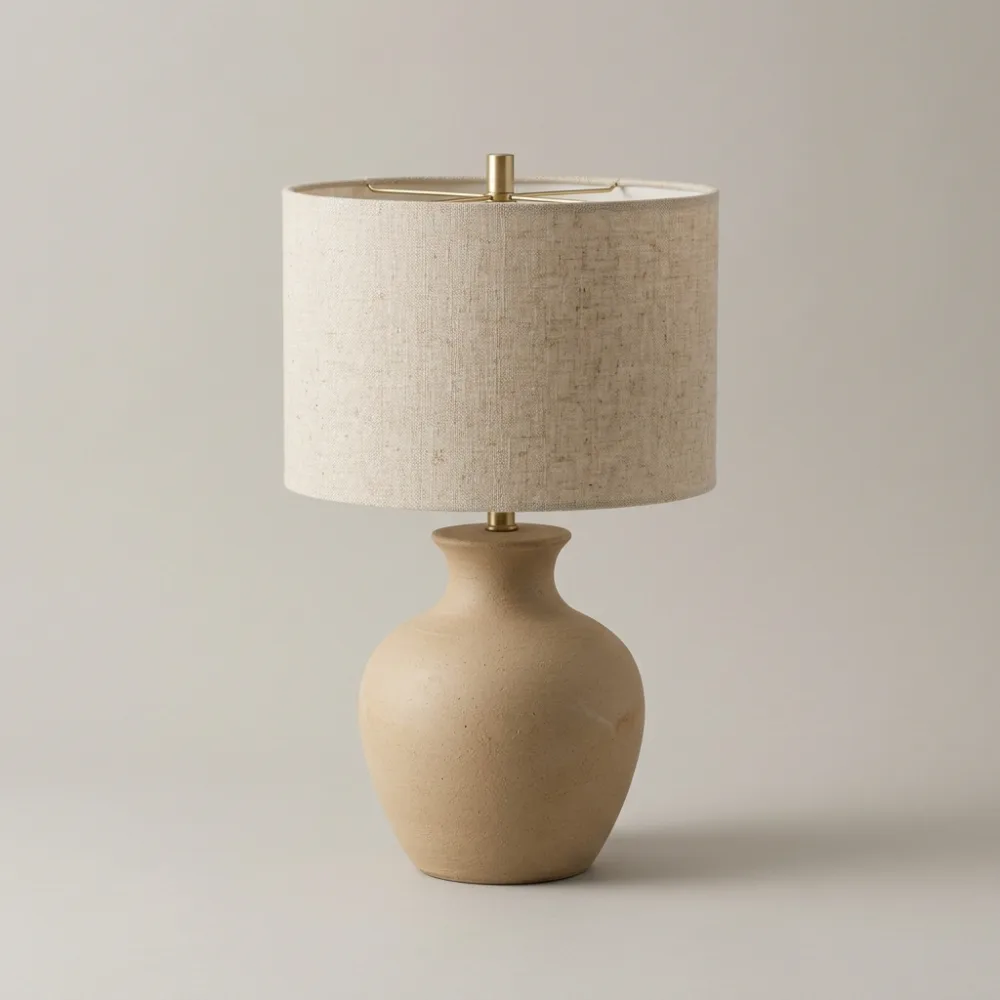 Sand-colored stoneware lamp with a linen shade